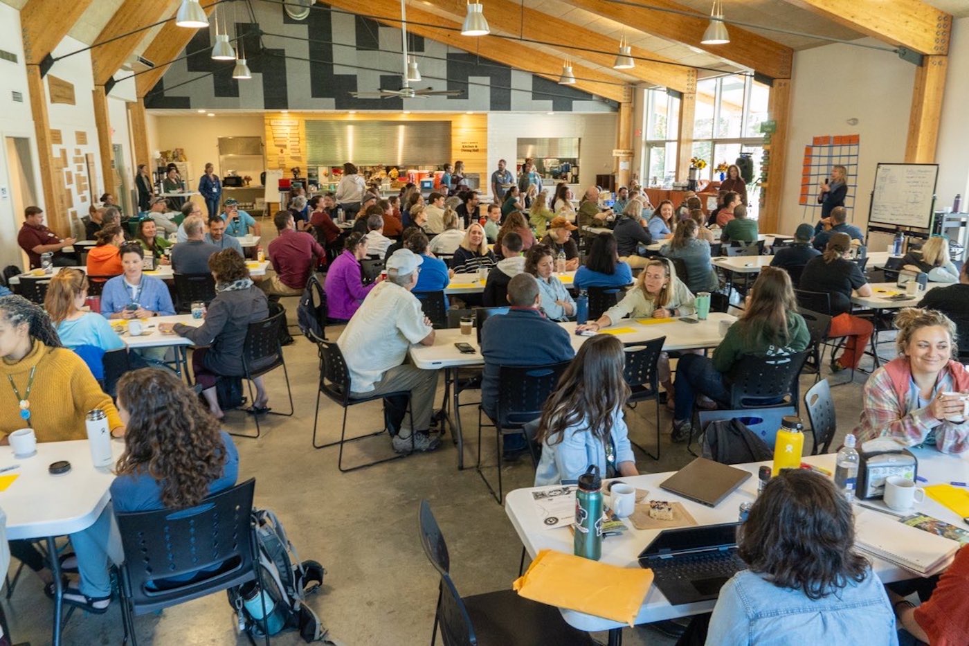 Summit participants at the Open Space Planning Session, where any Summit participant may create a discussion on a topic of their choice.