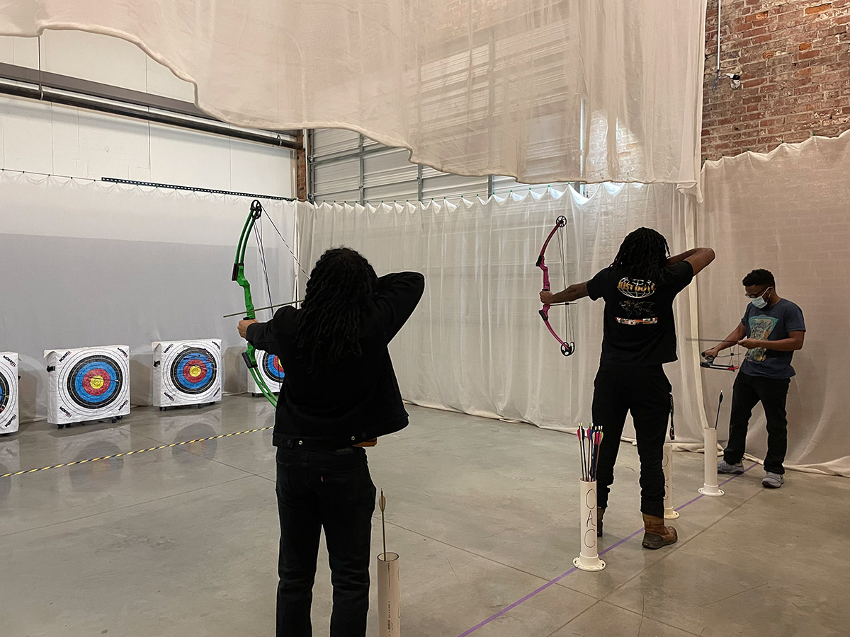  Guests learning archery copy