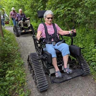 Visitors use Trackchairs at Lime Hollow Nature Center. Photo submitted by Lime Hollow Nature Center.